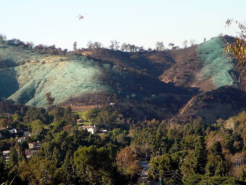 poison green hydromulch being sprayed in