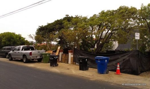 construction crew stops anyone from parking there with trash cans!