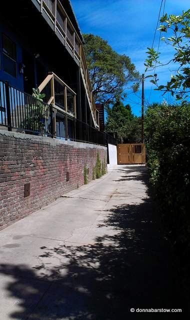 very long driveway behind house - probably they owned both lots at one time
