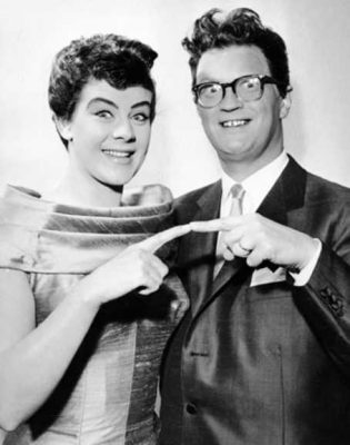 couple from the fifties touch fingers